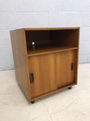 Mid Century teak music / record cabinet with sliding doors, on castors