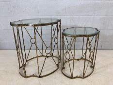 Nest of two gilt metal framed side tables with glass tops, the larger approx 58cm x 46cm x 61cm