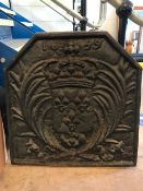 Cast iron fire back with shield and crown design, approx 58cm tall x 57cm wide x 4cm deep