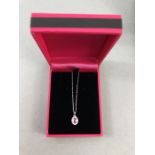 18CT W/G pink sapphire and diamond pendant of 60 points