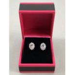 Pair of 18ct w/g diamond and acqamarine stud earrings 1.3ct's