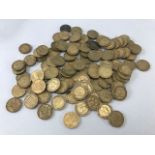 Collection of more than 100 brass threepenny pieces with various dates
