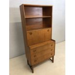 Mid Century tall sideboard with three drawers under, two shelves and drop fronted cupboard over by