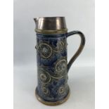 A large Doulton Lambeth stoneware jug, with hallmarked silver collar. Impressed mark to base Doulton