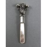 Silver babies rattle with mother of pearl handle