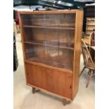 Mid Century teak display unit with sliding glass doors by Herbert E. Gibbs, approx 92cm x 27cm x