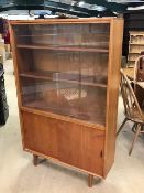 Mid Century teak display unit with sliding glass doors by Herbert E. Gibbs, approx 92cm x 27cm x