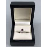 18CT W/G garnet and diamond ring of 90 points