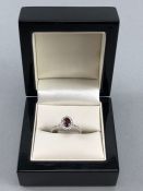 18CT W/G garnet and diamond ring of 90 points