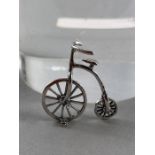 Silver figure of a penny farthing