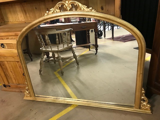 Large gilt framed over mantle mirror, approx 139cm wide at base x 106 tall at centre
