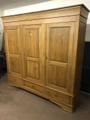 Extra large oak three door wardrobe with three drawers under and internal shelving, approx 230cm