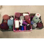 Large collection of wool and yarn in a variety of colours across four boxes. Approx 35 reels/cones