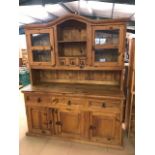 Large pine kitchen dresser with three cupboards and three drawers under and two glazed doors