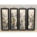 Set of four Chinese framed porcelain plaques depicting mountainous scenes, each approx 80cm x 28cm