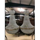 Pair of large ballroom style chandeliers with gilt frames and glass drops, approx height 110cm