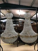 Pair of large ballroom style chandeliers with gilt frames and glass drops, approx height 110cm