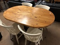 Oval pine kitchen table with painted base and four matching painted pine spindle back chairs