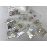 Eighteen George V and one Edward VII silver threepenny pieces plus a bag of 23 drilled silver coins