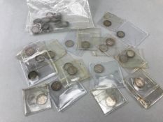 Eighteen George V and one Edward VII silver threepenny pieces plus a bag of 23 drilled silver coins