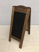 French wooden A-frame sign for 'Les Gourmands Chocolatier Confiserie' with blackboard inserts on