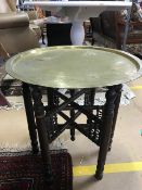 Folding tea table with brass tray top, approx 54cm in diameter