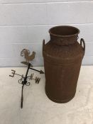 Vintage rusty milk churn and a cockerel weather vane