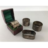 Four hallmarked silver napkin rings one in presentation box