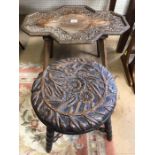 Heavily carved occasional table and stool with floral design and bobbin turned legs