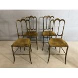 Set of heavy four Brass framed chairs stamped "Made In Italy". Four Italian brass salon chairs.