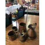 Collection of copper and brass spirit measures and warmers