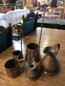 Collection of copper and brass spirit measures and warmers