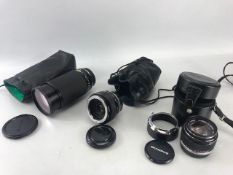 Three Olympus Fit camera lenses: Tokina 60-300 F/4 67mm HMC filter and case, Olympus 50mm F/1.4 with