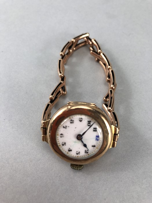 9ct Gold circular faced watch with 9ct Gold Bracelet, White face dark blue hands (total weight 22. - Image 2 of 4