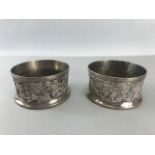 Two Silver coloured Wine coasters with grapes and vine design