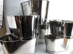 Three pairs of champagne buckets in graduating sizes, the largest pair 26cm tall x 46cm in length,