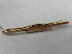 Hallmarked 9ct Gold tie Pin with a bird motif and safety chain total weight approx 7.3g