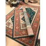 Pair of large green ground rugs, each approx 270cm x 190cm