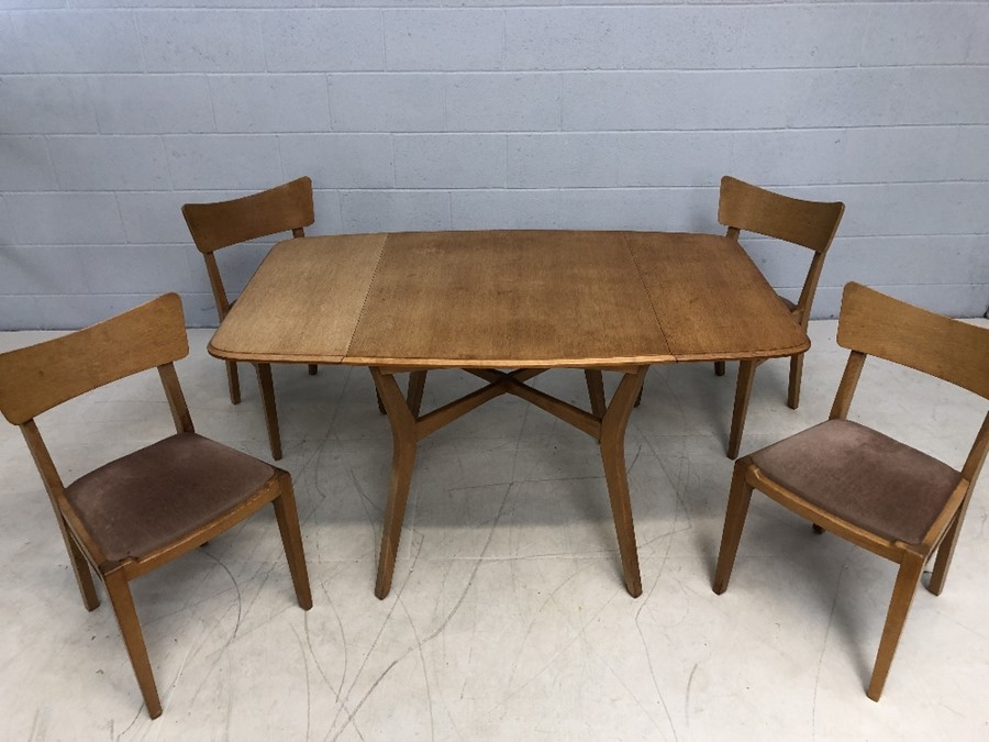 G-Plan (Gold EG stamp to base) cross stretcher dining table with two drop leaves and four matching
