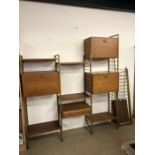 Mid Century modular shelving unit with six metal support structures, four modular units and nine