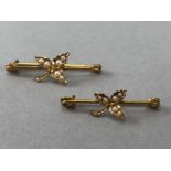 A Pair of 15ct Gold Brooches with floral sprays and each decorated with six seed pearls noth on