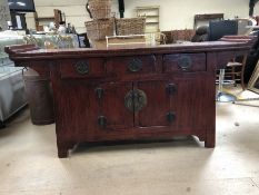 Chinese style sideboard with red and black patina and large metal fixings in the style of an alter