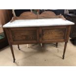 Oak wash stand with marble top on original castors, two drawers under