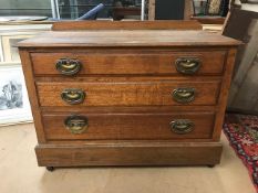 Low oak chest of three drawers with original handles (A/F)