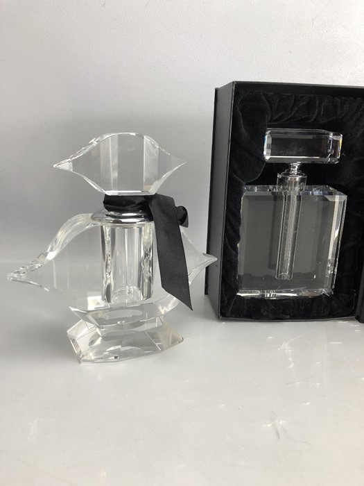 Two Oversized large Perfume bottles of French design one boxed (minor chip to lid of unboxed bottle)