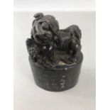 Chinese Foo Dog carved from marble with 28 characters marks to plynth and red markings to base