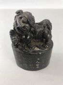 Chinese Foo Dog carved from marble with 28 characters marks to plynth and red markings to base