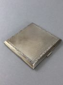 Hallmarked Silver Cigarette approx 8.5cm square with engine turned decoration, floral border and