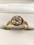 18ct Gold ring in the Revival style with a Blue enamel circular border, inside of which are a ring