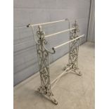 Wrought iron three tiered towel rail with scroll decoration